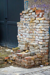 Reconstructed bricks recycled made from crushed waste manufactured product material outside on a street