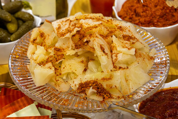 Sauerkraut finely cut raw cabbage fermented by various lactic acid bacteria and sprinkled with red pepper