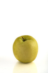Green apple isolated on white background with reflection and copyspace.