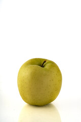 Green apple isolated on white background with reflection and copyspace.