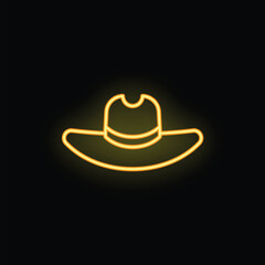 Yellow neon sign is glowing in the dark, showing the outline of a cowboy hat