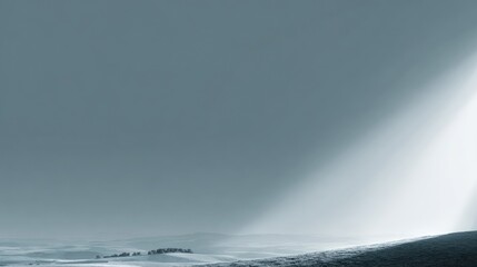Fototapeta premium Serene Landscape with Soft Light Rays Illuminating Rolling Hills and Gentle Fields Under a Calm Sky in Monochrome Tones and Minimalist Aesthetic