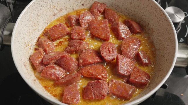 Traditional Turkish Sucuk Sausages Cooking in a Pan in Slow Motion