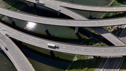 Travel by driving on highway interchange with cars on road trip and trucks shipping and transporting consumer products in America