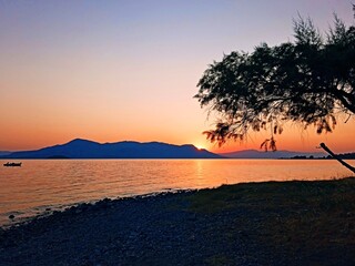 Greece - view of sunrise from the coast near the town of Kamena Vourla