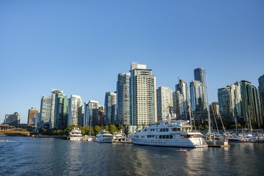 Sailing boats in marina, skyscrapers on the promenade, Coal Harbour, Vancouver, British Columbia, Canada