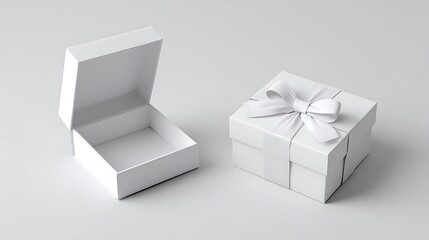 Two pristine white square boxes, one open, one closed with ribbon, set against a gray backdrop