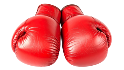 Two bright red leather boxing gloves sit centered, isolated against a black background
