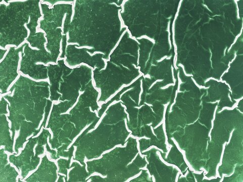 Detail of a toxic phosphogypsum waste pond in the vicinity of the town of Huelva. Aerial view. Drone shot. Huelva province, Andalusia, Spain