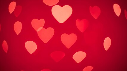 Vibrant red background with floating pink and red hearts for Valentine's Day