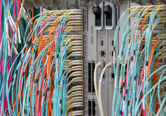 Fiber optic network cable and RJ45 copper cable connected to a server
