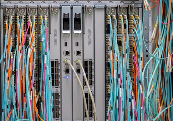 Fiber optic network cable and RJ45 copper cable connected to a server