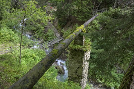 Water pipe leading across the Saldur stream, Schluderns, South Tyrol, Italy