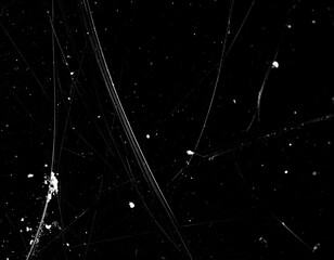 Black background, scratches and white dust. Abstract texture of damage, grunge and wear