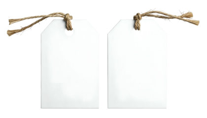 Two blank white rectangular tags with brown twine hanging from the tops against a black background