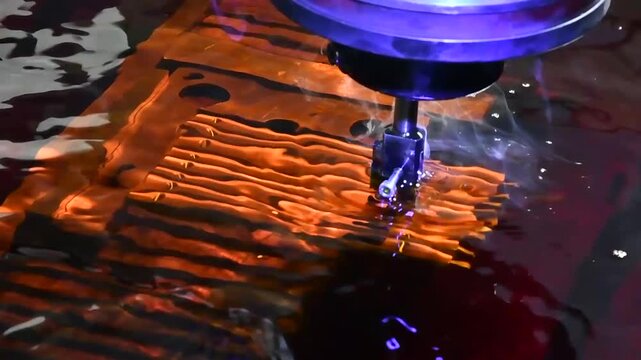 Electric stitching machine, erosion, metal cutting in liquid.  The electroerosion cutting machine cuts out metal parts. 