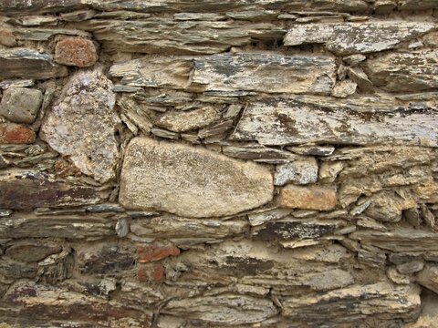 Rough stone wall background showing rustic texture