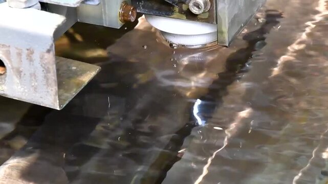 Milling of metal in water. Electroerosion machine, erosion, metal stitching using an electric charge. The electric sewing machine creates iron parts. 