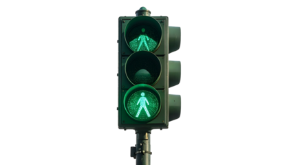Green pedestrian crossing signal glows brightly, black background, close-up shot of a traffic light