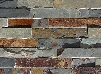 Natural stone wall background with rustic texture © insideportugal