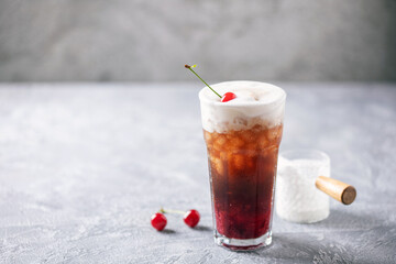 Cherry cola dirty soda in glass. Trending summer drink