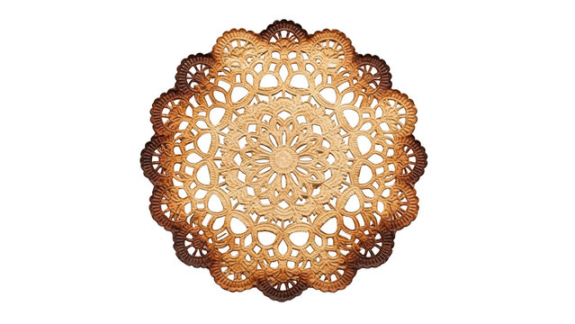 Ornate golden brown lace doily with intricate floral pattern on black background image