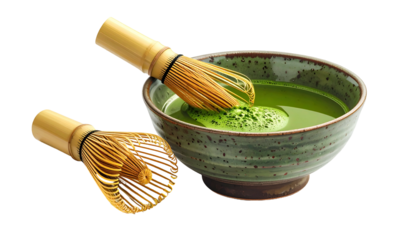 A bowl of vibrant green matcha tea with a bamboo whisk, another beside it, on black