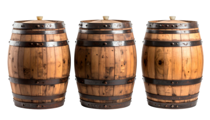 Three weathered wooden barrels, tightly bound with metal hoops, against a black backdrop
