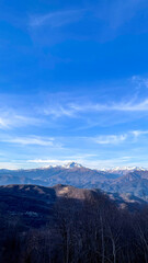 Fototapeta premium Majestic mountains under ethereal skies, winter solstice hush, perfect for cosmic contemplation, and capturing solivagant alpine adventures