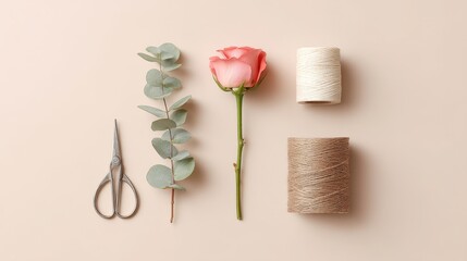 Rose, scissors, and twine are arranged on a table. Valentines day.