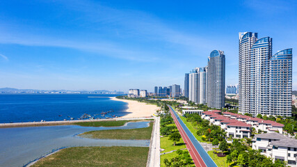 Modern Coastal City with High-Rise Hotels and Sandy Beach Shoreline © QuachVan