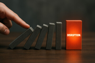 Disruption market domino hand gray block red block A business concept scene with a hand to push gray domino blocks toward a glowing red block labeled DISRUPTION conveying dramatic