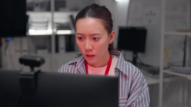 Cyber attack crisis shocked woman facing security breach, Stressed Asian woman in office reacting to hacker attack on screen. data theft risk, network security failure