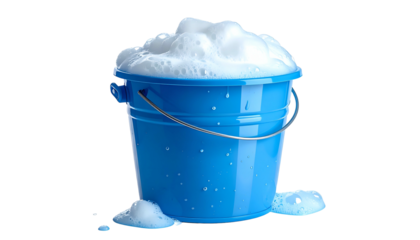 A blue bucket overflowing with suds, with some spilled foam at the base