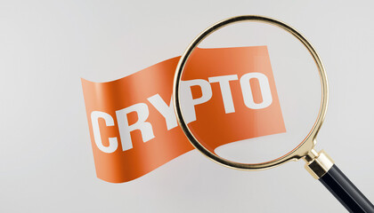 3d magnifying glass hovering over a flag with text saying crypto, grey background