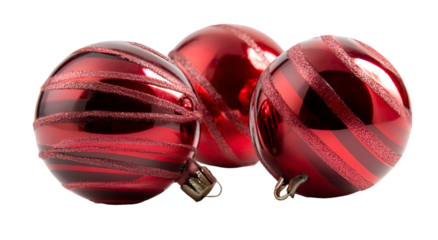 Three glossy red spheres with diagonal glitter stripes, festive holiday decor