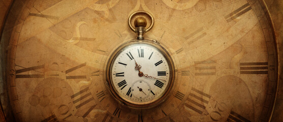 The old antique classic clocks on a vintage wide paper background. Concept of time, history, science, memory, information. Retro style. Vintage clockwork aand watch background.