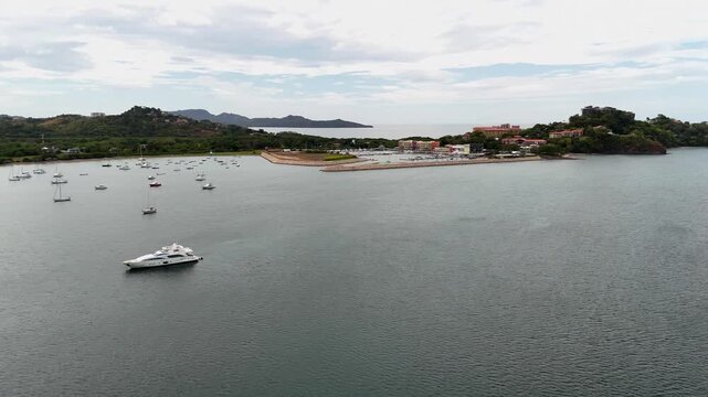 Aerial drone footage Flamingo Marina overlooking luxury oceanfront villas and boat storage in Guanacaste Costa Rica.
