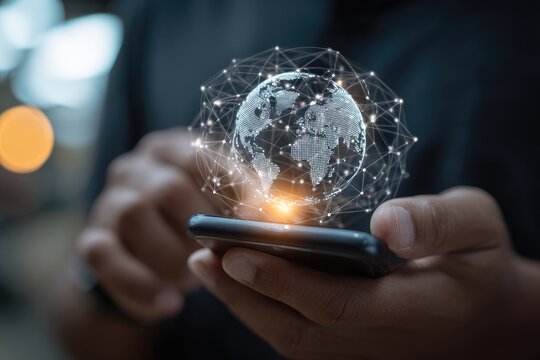 Close-up of hands holding a phone with a digital world map hovering above it - Powered by Adobe