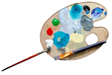 Palette with multi-colored paints and brushes top view