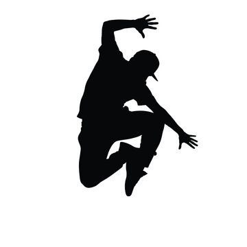 Silhouette of a breakdancer performing a dynamic jump