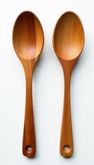 Elegant carved wooden salad servers, pristine white background, woodworking, kitchen tools, kitchenware