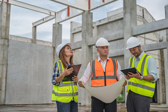 Team of construction engineers and architects discussing blueprint and project details at building site, showcasing teamwork, engineering, infrastructure development, and site planning. - Powered by Adobe