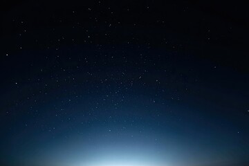 Obraz premium A dark night sky filled with countless, twinkling stars; a gradient of blue