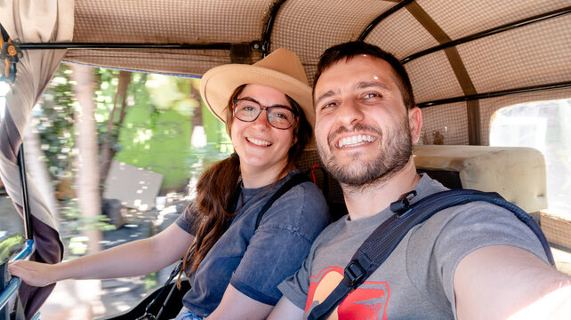 Couple rides tuk-tuk through Mto Wa Mbu adventure