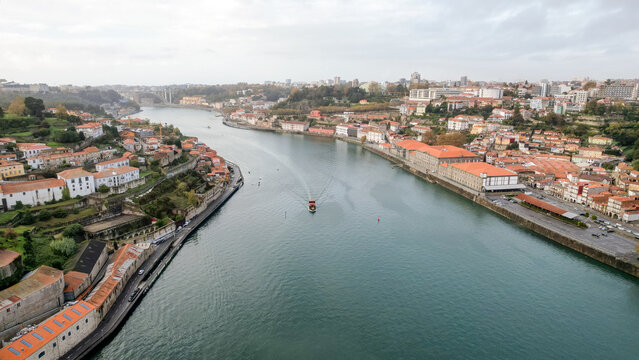 Boat sailing on Douro River with Porto and Vila Nova de Gaia