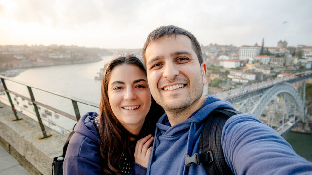 Couple's selfie at sunset over Porto's iconic landmarks