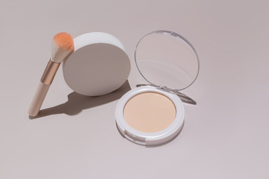 Compact powder and brush with cosmetic sample display
