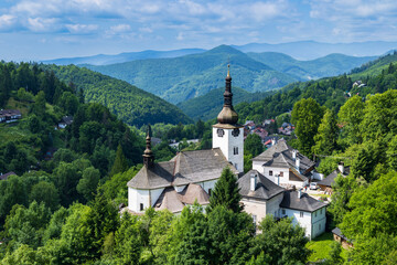 Fototapeta premium Historic church standing in mining village Spania Dolina, Slovakia