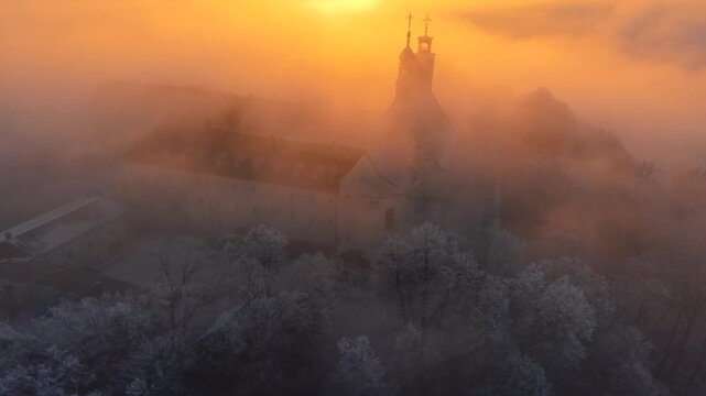 winter monastery in the fog drone shot